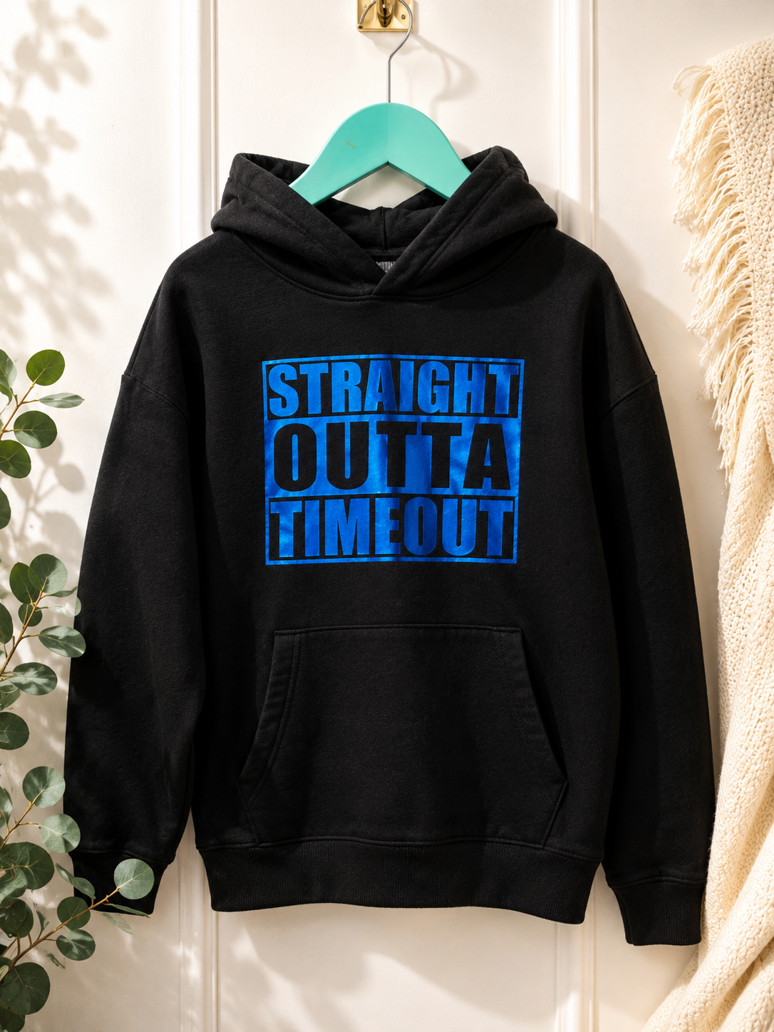 Straight Outta Timeout black kids hoodie on a teal hanger