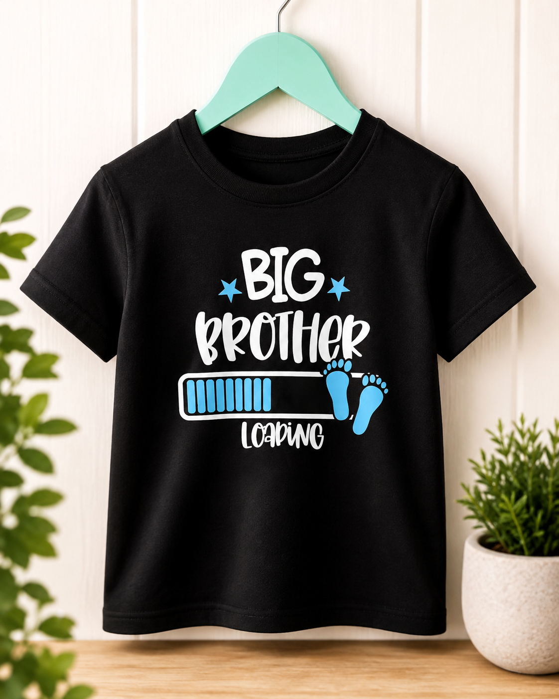 Big Brother Loading black kids tee on a teal hanger