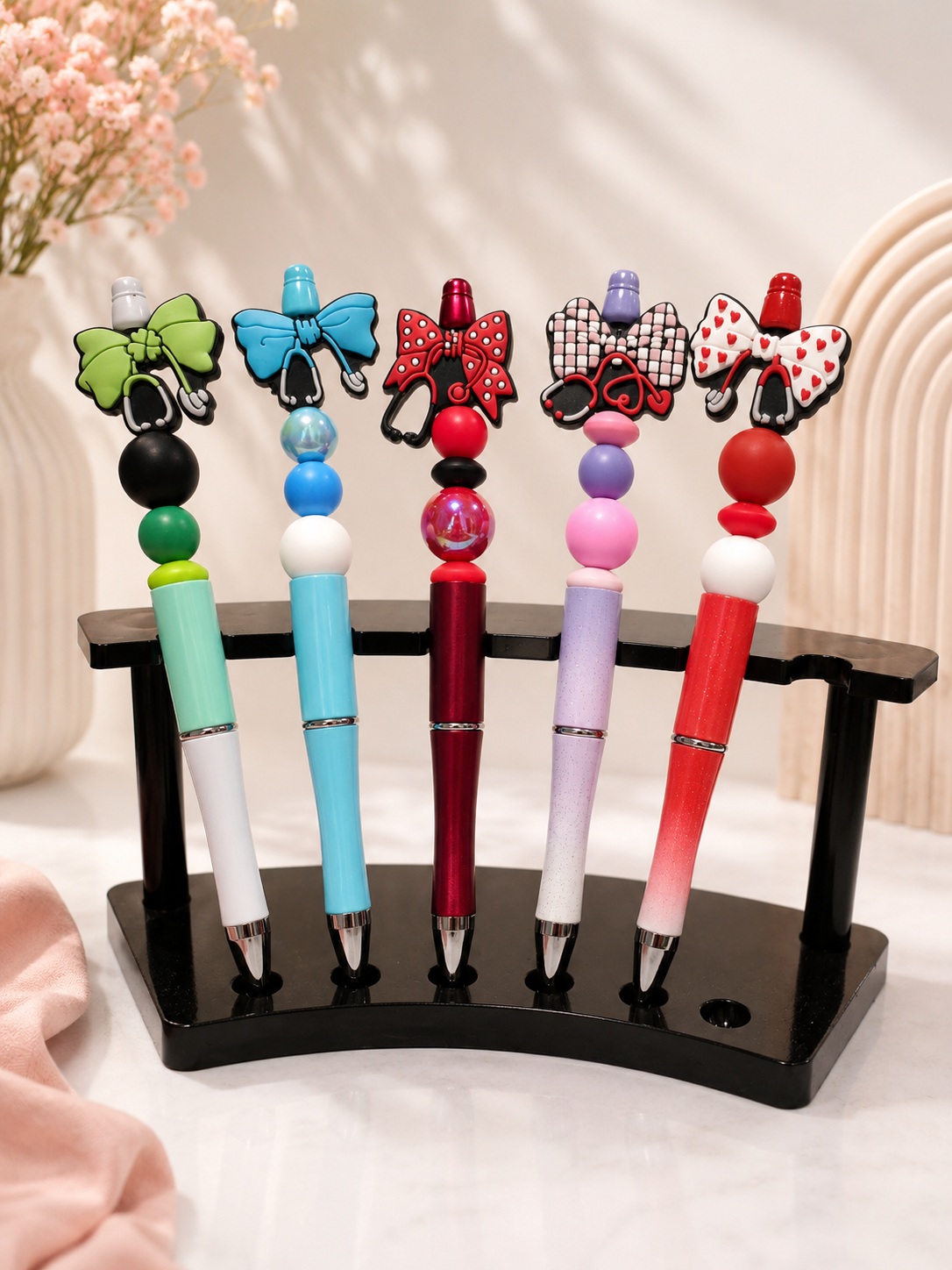 Custom beaded pens with colourful bow charm toppers
