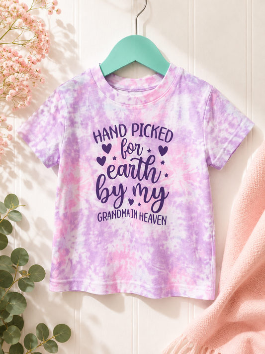 Hand Picked For Earth By My Grandma In Heaven purple tie-dye baby tee on a teal hanger